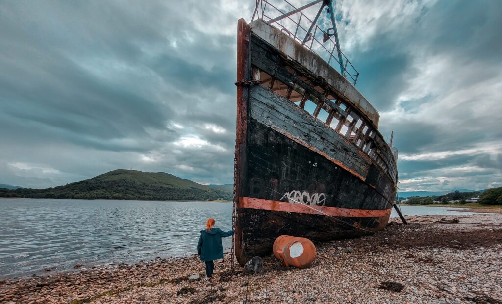 girl and shipwreck